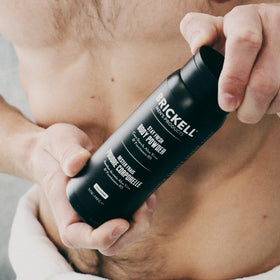 Brickell 5 oz container next to everyday items showing portable grooming benefit