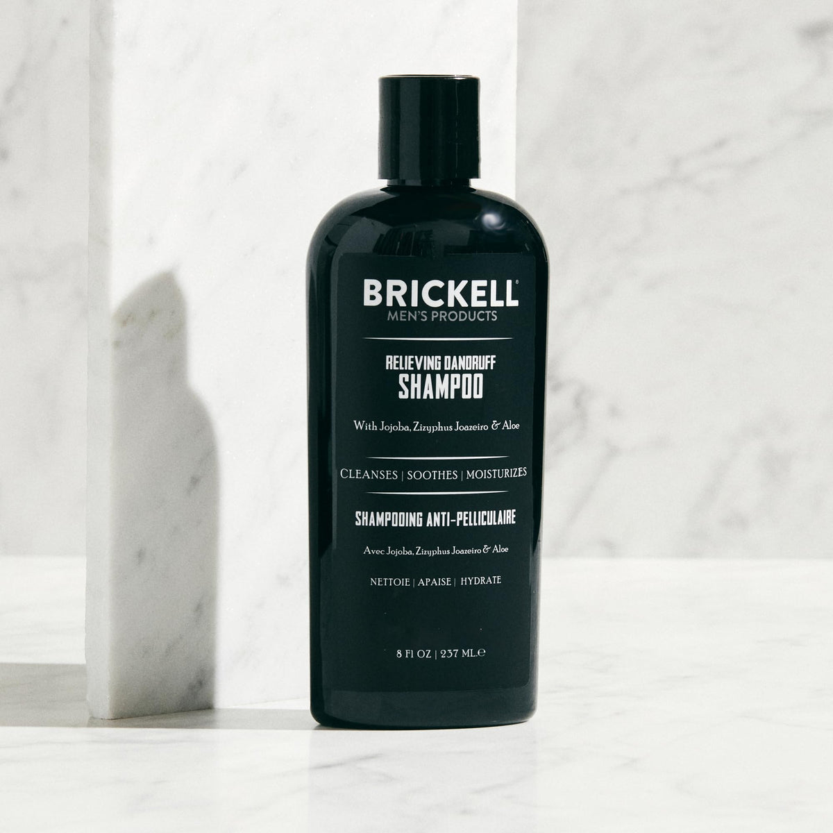 Brickell shampoo lather texture demonstrating gentle cleansing and flake removal