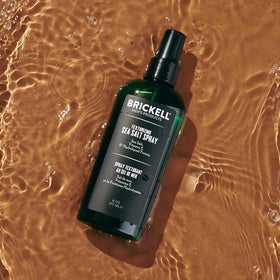 Sea salt crystals and Brickell bottle highlighting natural ingredient for visible texture