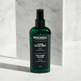 Male model hair styled with Brickell spray demonstrating textured, natural beachy volume