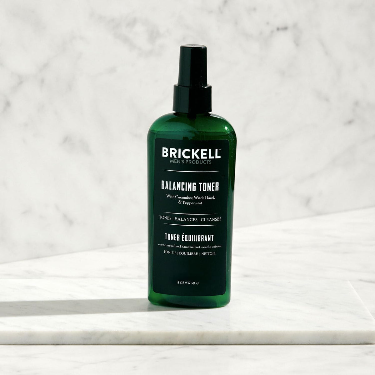 Brickell toner applied to man's hand demonstrating quick absorption and fresh feel