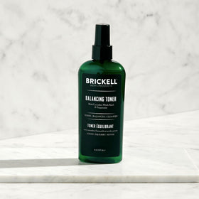 Brickell toner applied to man's hand demonstrating quick absorption and fresh feel