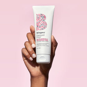 Stylist blow-drying hair with Briogeo for smoother faster styling