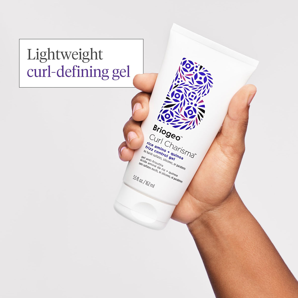 Briogeo application on damp curly hair demonstrating even distribution