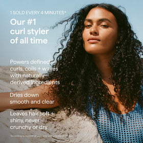 Briogeo model applying cream to curls for enhanced shape and softness