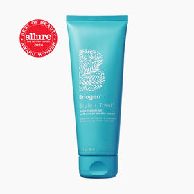 Briogeo open cap revealing smooth cream texture, illustrating easy spreadability