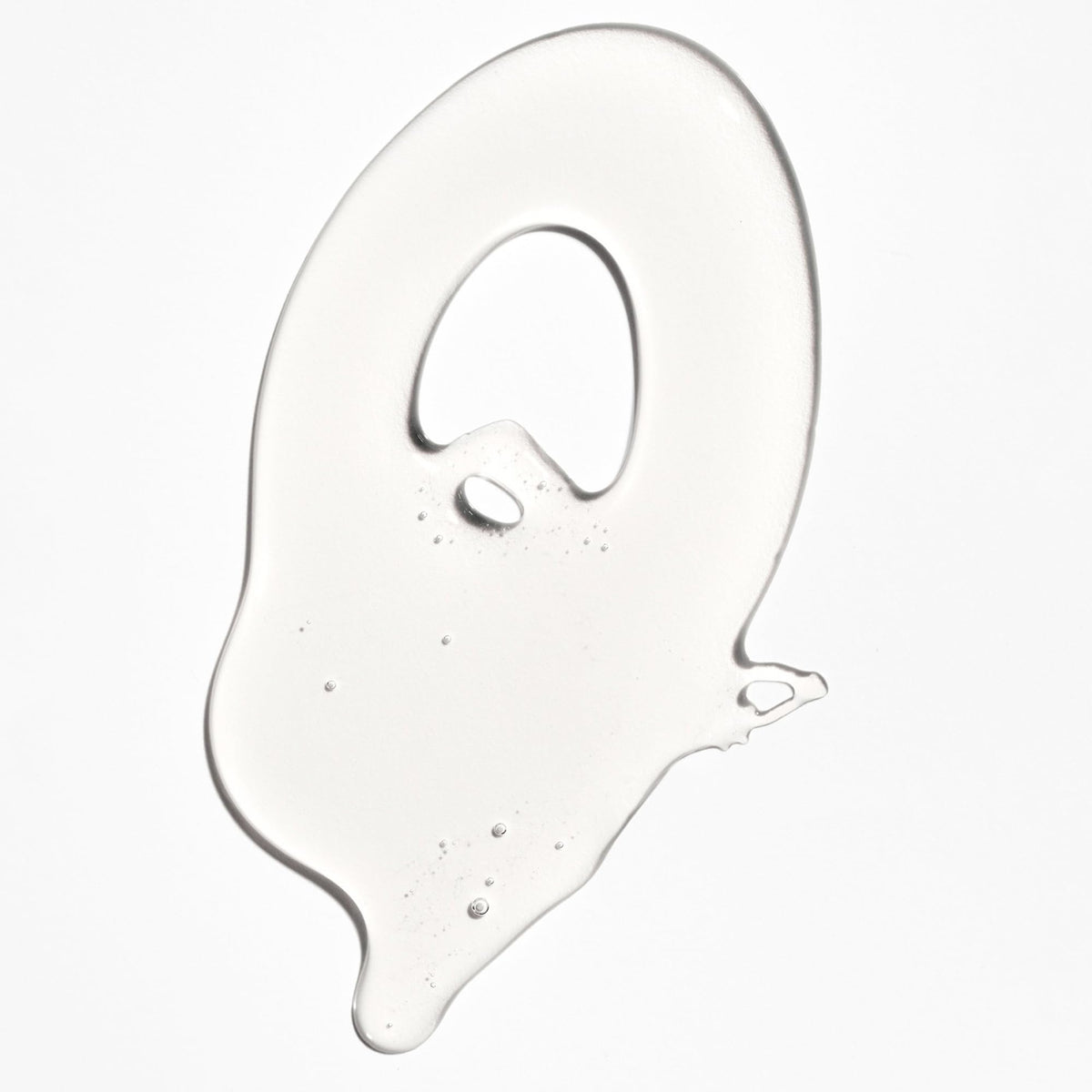 Briogeo shampoo dispensed into hand, foamy texture for mild yet effective clean