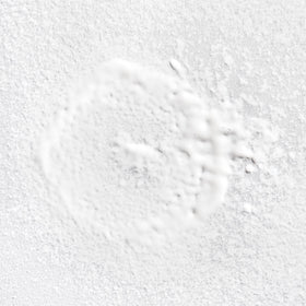 Briogeo Rosarco Milk sprayed from hand for easy detangling benefit
