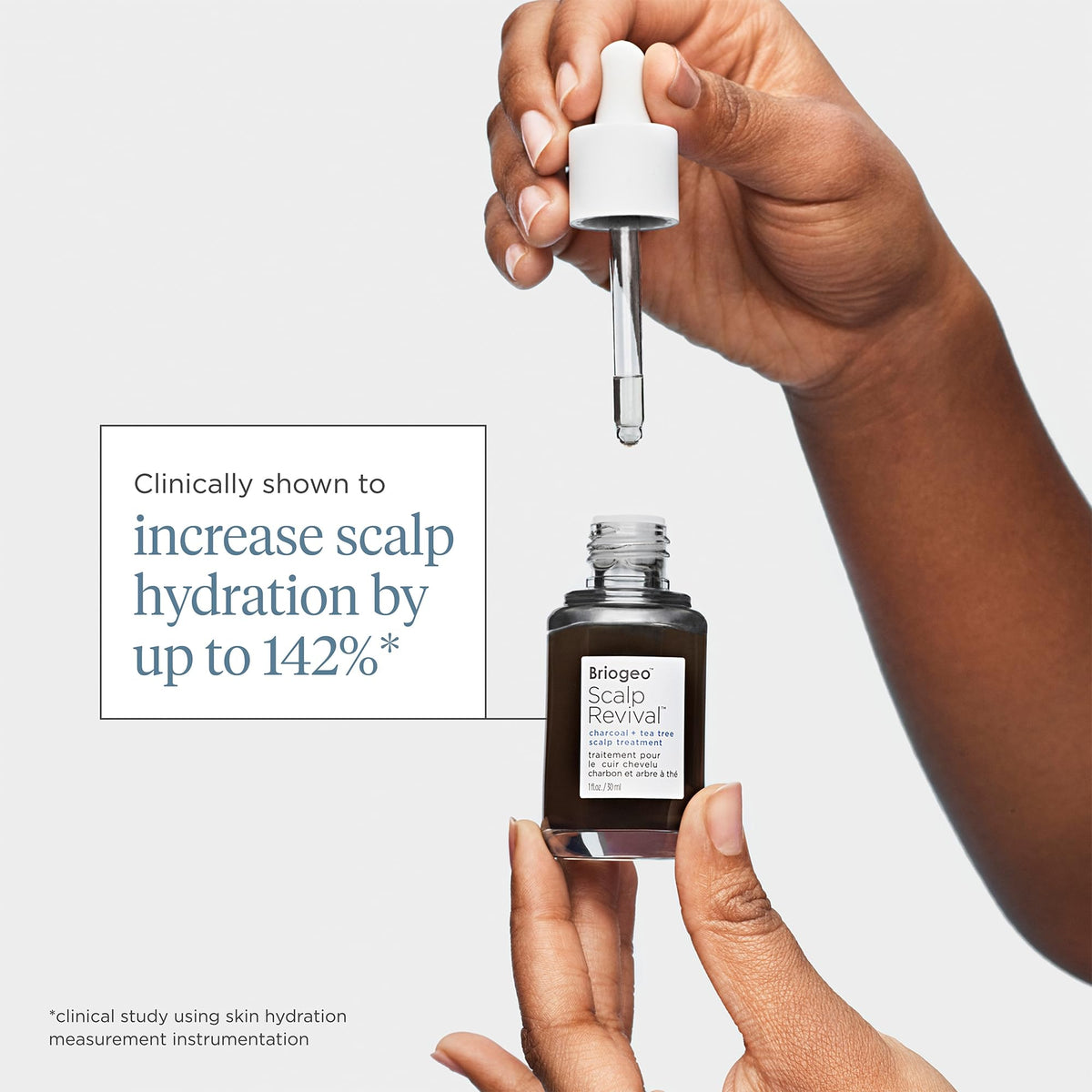 Briogeo applying serum to scalp showing targeted treatment for flakes and itch