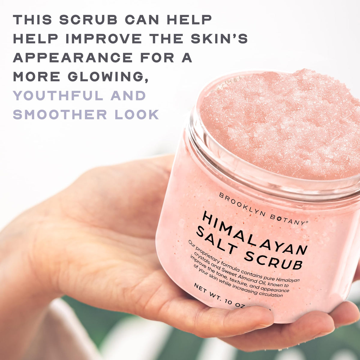 Brooklyn Botany applying scrub to hand to show gentle exfoliation and hydration