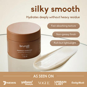Brunae Body bottle beside hand to show product size and portability