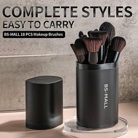 BS-MALL brushes held in hand for size comparison showing compact, travel-ready scale