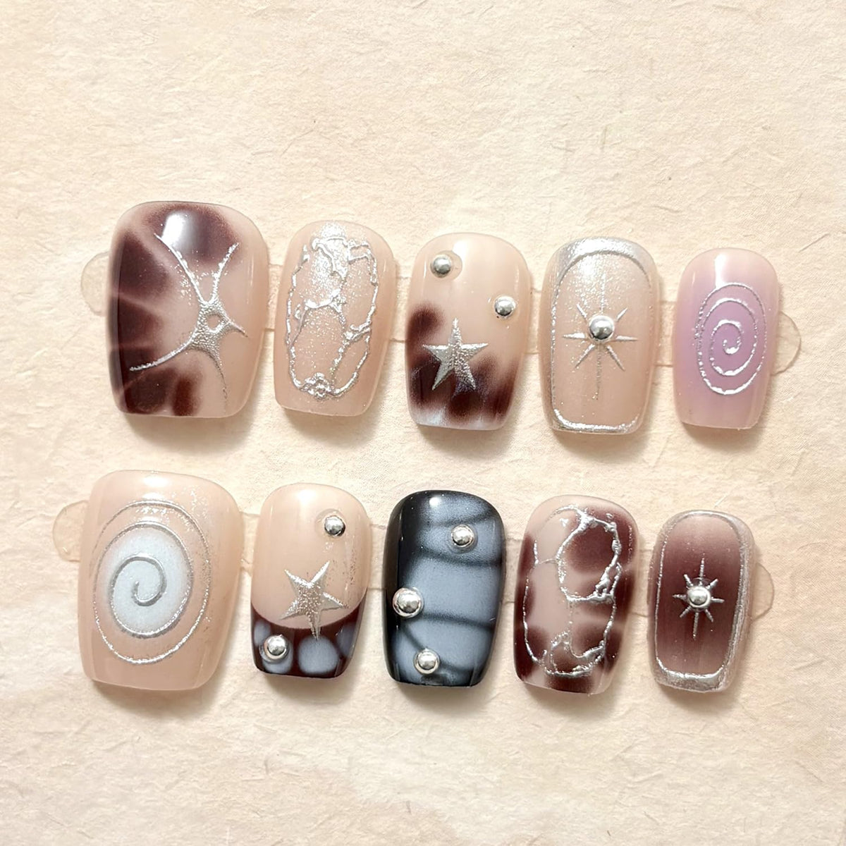BSBTBZ close-up of irregular French tips highlighting pattern precision and shine