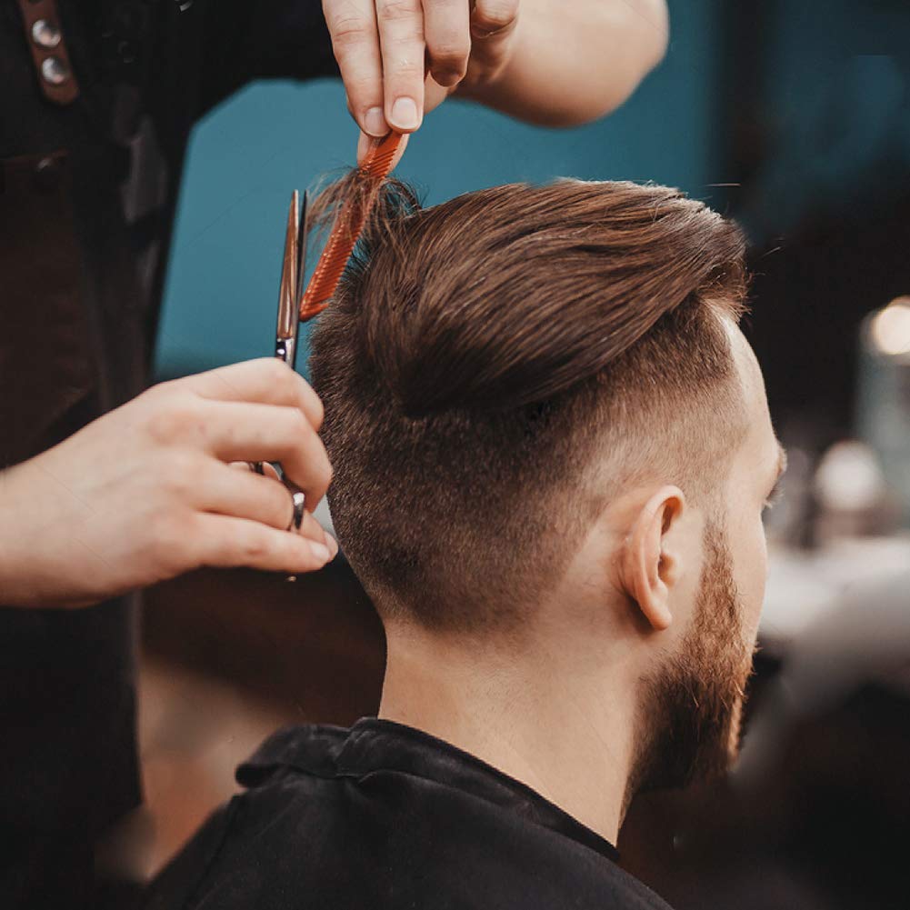 BSFHH cape in use on client in salon chair protecting clothes during haircut