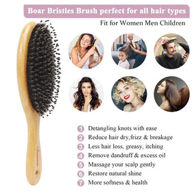 Bsisme brush held in hand to show size and comfortable bamboo grip for everyday use