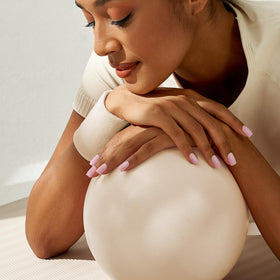 BTArtbox lifestyle image of hands typing at desk wearing nails for durable daily use benefit