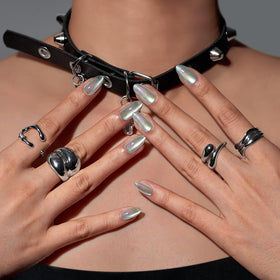 BTArtbox side profile of a single short almond nail emphasizing thin base and natural cuticle blend
