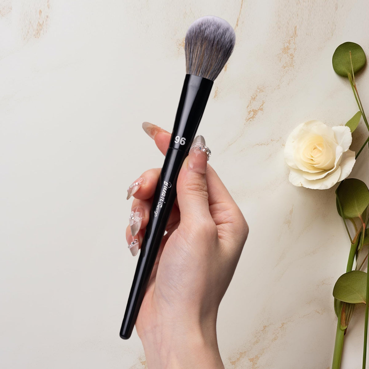 Bueart Design brush applying blush on cheek for natural, buildable color