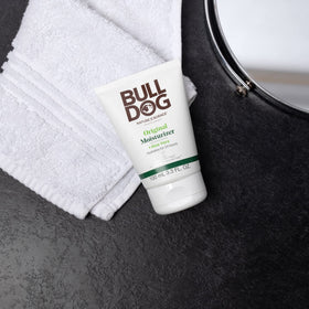 Man using Bulldog face wash splashing water for quick effective cleansing