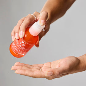Bumble and bumble application on hands demonstrating easy distribution and slip