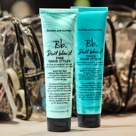 Bumble and bumble on bathroom shelf suggesting everyday styling routine