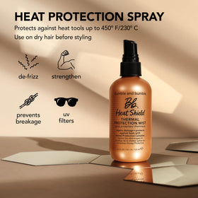 Bumble and bumble bottle near styling tools illustrating pre-styling protection