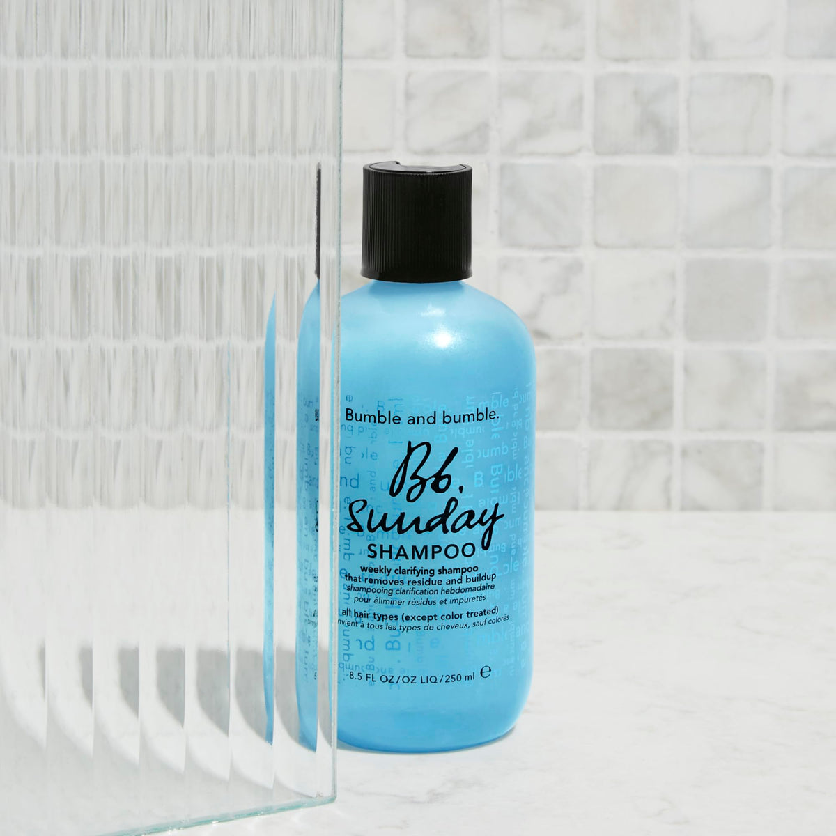 Bumble and bumble bottle styled on bathroom shelf suggesting weekly ritual
