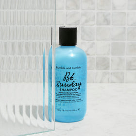 Bumble and bumble bottle styled on bathroom shelf suggesting weekly ritual