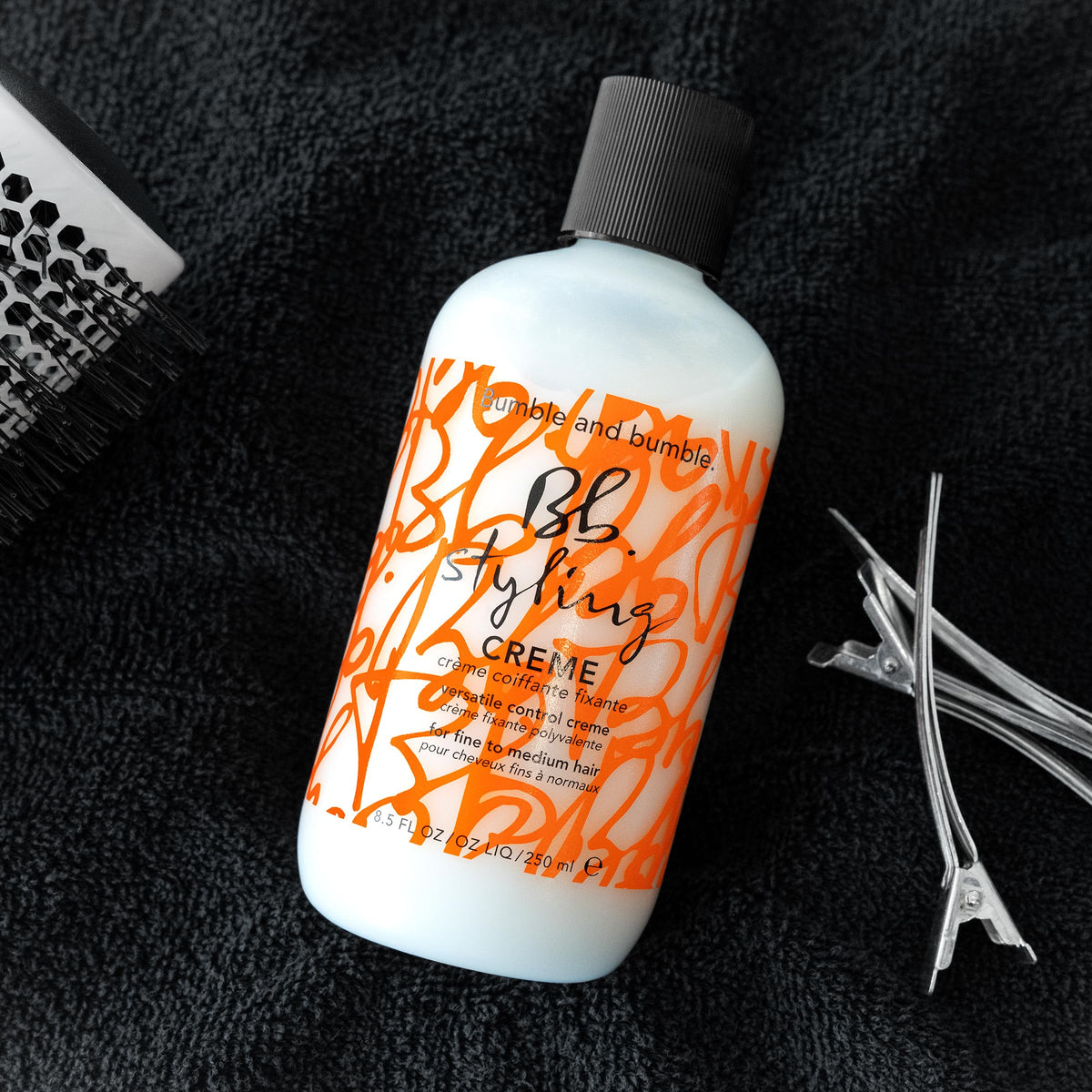 Bumble and bumble jar on vanity in bathroom showing everyday styling convenience