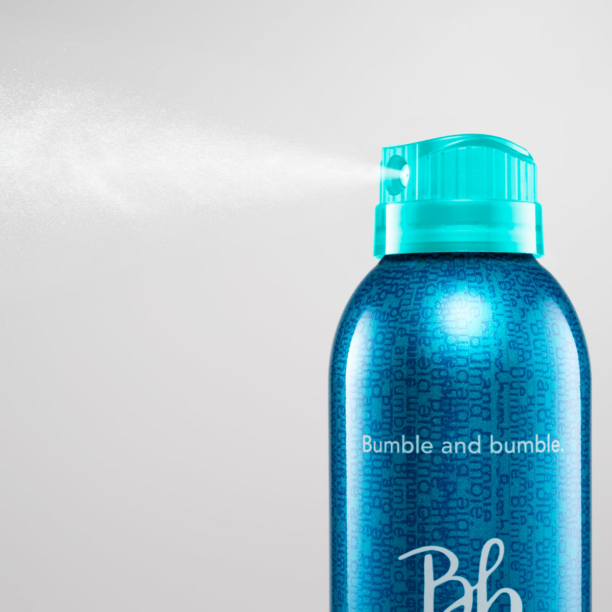 Bumble and bumble bottle held in hand illustrating 10 ounce size and portability