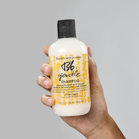 Bumble and bumble shampoo on shower shelf in lifestyle scene for everyday care