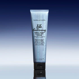 Bumble and bumble 5 fl oz tube next to hand for clear size reference benefit