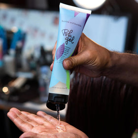 Bumble and bumble styling in use shaping hair for defined, brushable hold