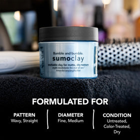 Open jar of Bumble and bumble Sumoclay revealing the product texture and depth