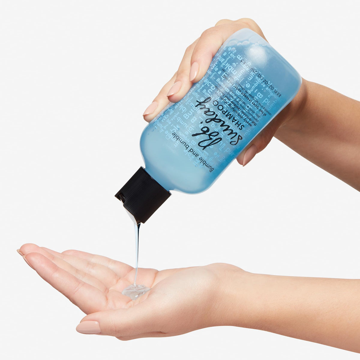 Bumble and bumble bottle in shower illustrating in-use rinsing benefit