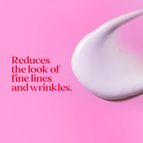 Burt's Bees applying spot corrector to cheek to reduce dark spots