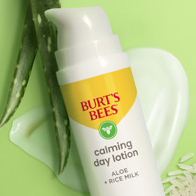Burt's Bees applying lotion to cheek to show calming effect on skin