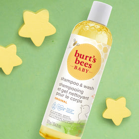 Burt's Bees wash paired with lotion in nursery styling scene
