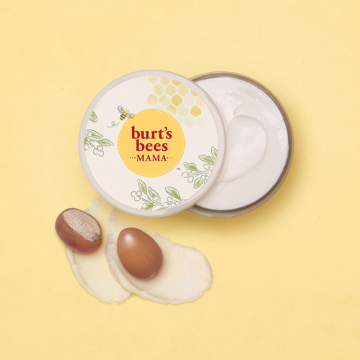 Burt's Bees open jar with spoon showing buttery consistency