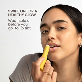 Lifestyle shot of Burt's Bees lip balm inside a purse demonstrating on-the-go convenience