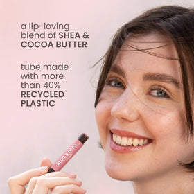 Burt's Bees stick held in hand showing travel-friendly size and portability