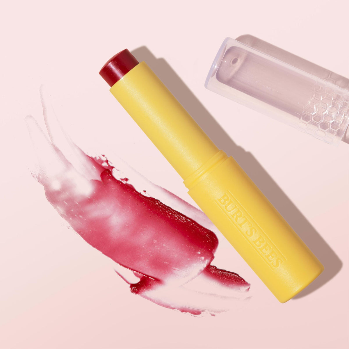 Burt's Bees in a handbag lifestyle scene showing on-the-go moisturizing benefit