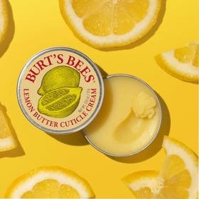 Burt's Bees being massaged into a cuticle to soften and repair