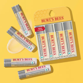 Burt's Bees four tubes arranged to show compact travel-ready set