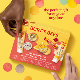 Burt's Bees kit held in a hand to show compact scale and portability benefit