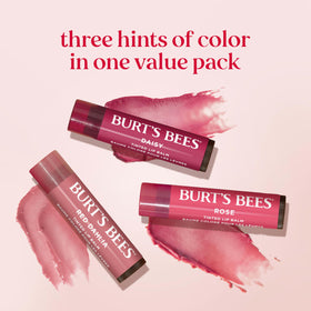 Burt's Bees lifestyle image of woman applying balm for quick no-mirror touch-up