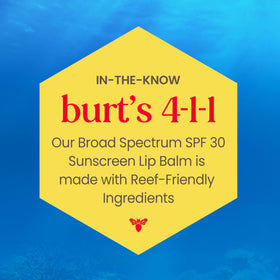 Burt's Bees balm in hand to show compact travel-friendly size and convenience