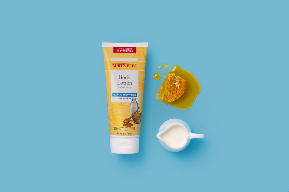 Burt's Bees lotion applied to forearm in bright bathroom, shows smooth finish