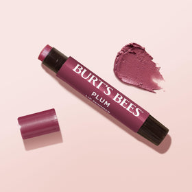 Burt's Bees in a handbag scene illustrating on-the-go touch-up convenience