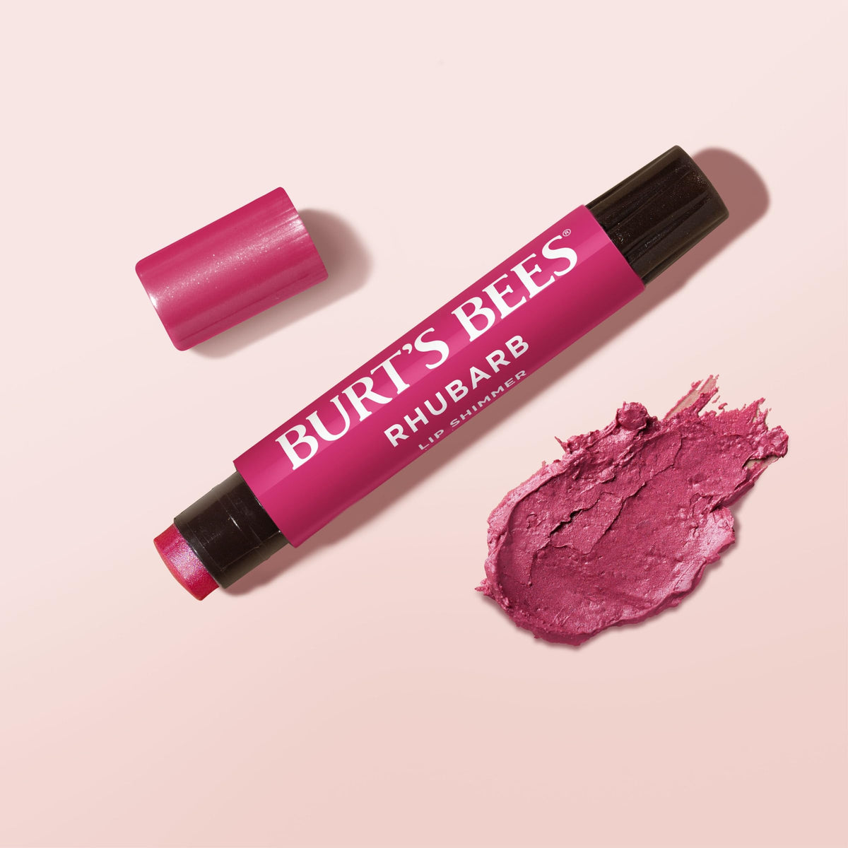 Burt's Bees lip tint inside a handbag lifestyle shot showing on-the-go convenience